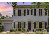 Charming two-story home with black shutters and a well-maintained front yard, providing excellent curb appeal at 9107 Royal Highlands Ct, Charlotte, NC 28277