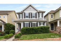Charming two-story home with a well-manicured lawn and inviting front porch at 2313 Blueberry St, Belmont, NC 28012