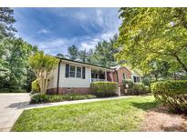 Charming home with a well-manicured front yard, brick accents, and an inviting porch at 2434 Olewoods Ct, Rock Hill, SC 29732