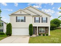 Charming two-story home with a well-manicured lawn and a two-car garage in a beautiful residential neighborhood at 3512 Gibbon Terrace Ct, Charlotte, NC 28269
