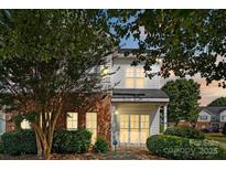 Charming two-story home featuring brick accents and lush landscaping in a well-maintained community at 6443 Mallard View Ln, Charlotte, NC 28269