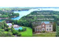 Stunning aerial view of Lake Norman community, The Harbour At The Pointe, with lush greenery and lake access at 134 Lake Spring Loop, Mooresville, NC 28117