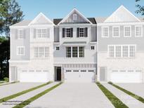 Charming townhome featuring a two-car garage, complemented by decorative shutters and stylish architectural details at 1029 Bandon Dr, Waxhaw, NC 28173
