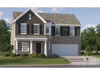 Charming two-story home with a brick and dark siding exterior and an attached two-car garage at 1511 River Cane St, Edgemoor, SC 29712
