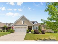Charming single-Gathering home featuring a two-car garage and well-maintained landscaping at 163 Carmen Way, Lancaster, SC 29720