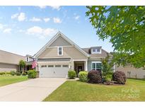 Charming single-Gathering home with well-manicured lawn, attached garage, and inviting curb appeal at 163 Carmen Way, Lancaster, SC 29720