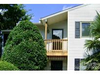 Two-story home featuring a balcony and light siding with dark shutters at 1638 Hunters Trl, Rock Hill, SC 29732
