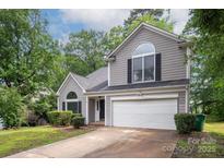 Charming two-story home featuring manicured landscaping and a two car garage at 3826 Yorkford Dr, Charlotte, NC 28269