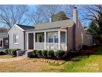 Charming single Gathering home with a covered front porch and well-maintained landscaping at 432 4Th Street Sw Pl, Hickory, NC 28602