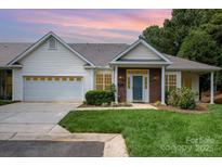 Charming single Gathering home with a well manicured lawn and attached garage at 6204 Half Dome Dr, Charlotte, NC 28269