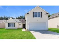 Charming home featuring a two-car garage, lawn, and neutral siding at 2599 April Showers Ln, Rock Hill, SC 29730