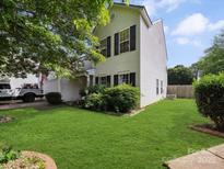 Charming two-story home featuring manicured lawn, vinyl siding, and traditional window shutters at 3014 Robin Terry Ct, Charlotte, NC 28208