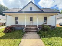 Charming single-Gathering home featuring a quaint front porch, inviting entrance and lush front yard at 324 S Spruce St, Rock Hill, SC 29730