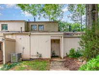 Inviting two-story townhome featuring neutral siding, a covered entryway, and mature trees enhancing curb appeal at 3617 Willow Point Dr, Charlotte, NC 28277