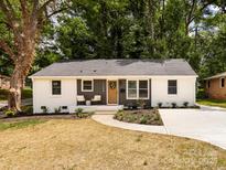 Charming renovated home with a newly landscaped front yard and fresh exterior paint at 1152 Penrose Ln, Charlotte, NC 28217