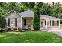 Charming single-story home with manicured lawn and inviting front porch at 1626 Riverglenn Ct, Rock Hill, SC 29732