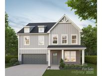 Charming two-story home with gray siding, dark roof, and attached two-car garage with a concrete driveway at 1807 Country Club Rd, Lincolnton, NC 28092
