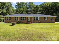 Charming one-story brick house with a well-manicured lawn and mature trees at 1810 Country Manor Ln # 34, Rock Hill, SC 29730