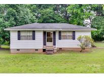 Charming single story home with a white exterior, black shutters, and well-maintained front lawn at 2921 Ambrose Dr, Gastonia, NC 28056