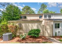 Charming townhouse featuring a landscaped yard and a neutral color palette, offering a welcoming curb appeal at 7900 Horse Chestnut Ln, Charlotte, NC 28277
