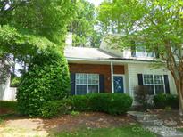 Charming townhouse with a brick facade, well-manicured shrubs, and inviting curb appeal at 9139 Charminster Ct, Charlotte, NC 28269
