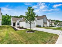 Charming home with a well-manicured lawn, white siding, and a welcoming front entrance at 139 Batten Ridge Dr, Statesville, NC 28677