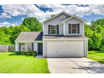 Charming two-story home with a two-car garage and well-manicured front lawn at 1791 Rosewell Dr # 65, Rock Hill, SC 29732