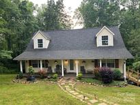 Charming two-story home with a welcoming front porch and meticulously landscaped front yard at 223 Tennessee Trl, Lincolnton, NC 28092