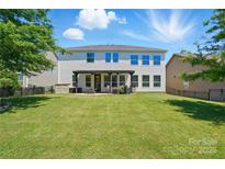 Large, well-maintained backyard with a covered patio, perfect for outdoor entertaining and relaxation at 1478 Imperial Ct, York, SC 29745