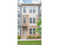 Charming townhouse with brick and siding exterior, featuring a welcoming entrance and well-maintained landscaping at 3007 Citizens Ln, Charlotte, NC 28205
