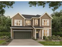 Two-story home with brown siding, a two-car garage, a landscaped yard and a dark roof and trim at 718 Lithia Inn Rd, Lincolnton, NC 28092