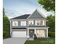 Charming two-story home with blue siding, white trim, a covered porch, and a two-car garage at 722 Lithia Inn Rd, Lincolnton, NC 28092
