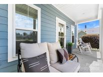 Inviting front porch with cozy seating and pleasant curb appeal at 1067 33Rd Avenue Ne Loop, Hickory, NC 28601