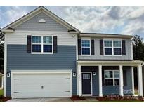 Charming two-story home with a two-car garage, inviting front porch and pleasing two-tone color palette at 3734 Coleman Dr, Charlotte, NC 28215