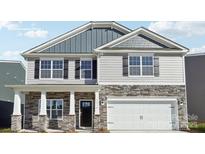 Charming two-story home featuring a stone facade, black shutters, and a two-car garage at 3734 Coleman Dr, Charlotte, NC 28215