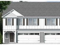 New construction home with vertical siding, a gray roof, brown shutters, and a two-car garage at 3926 Litchfield Rd, Charlotte, NC 28211