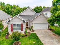 Charming single-Gathering home with a well-manicured lawn and attached two-car garage at 539 Turquoise Way, Fort Mill, SC 29708