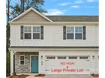 Charming two-story home with a modern exterior, stone accents, and an attached garage with a teal front door at 6712 W Sugar Creek Rd, Charlotte, NC 28269