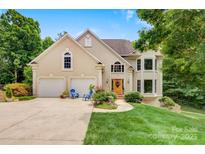 Inviting exterior with a two-car garage and a well-manicured lawn and attractive architectural elements at 133 37Th Avenue Nw Pl, Hickory, NC 28601