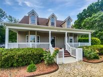 Charming home with a inviting front porch, well-kept landscaping, and a stone walkway at 204 W Boyd St, Maiden, NC 28650
