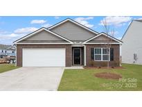 Charming single-story home with a brick facade, attached garage, and well-maintained lawn at 2650 Goose Fair Rd, Maiden, NC 28650