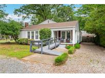 Charming single-story home featuring a welcoming front porch and a convenient access ramp at 34 Admiral Sw Ave, Concord, NC 28027