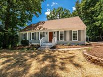 Charming single-story home with a neutral exterior, shutters, and a welcoming front porch at 7356 Terrace Dr, Charlotte, NC 28211
