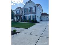 Charming two-story home with landscaped front yard, attached garage and concrete driveway at 85017 Newloch Ct, Lancaster, SC 29720