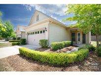 Charming home features a two-car garage and manicured landscaping at 238 Cherrytree Dr, Fort Mill, SC 29715