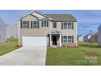 Charming two-story home with a well-manicured lawn and a two-car garage in a suburban neighborhood at 2629 Goose Fair Rd # 61, Maiden, NC 28650