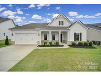 Charming home boasts a well-manicured lawn, white exterior, and inviting front porch at 3255 Split Rail Ln, Lancaster, SC 29720