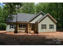 Charming home featuring a covered porch and a freshly painted exterior with black shutters at 3452 Hands Mill Hwy, York, SC 29745