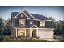Charming two-story home features mixed siding, an attached garage, and well-maintained landscaping at 8004 Plymouth Dr, Sherrills Ford, NC 28673