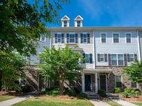 Charming townhome with light blue siding, stone accents, and black shutters at 1142 Doveridge St, Charlotte, NC 28273